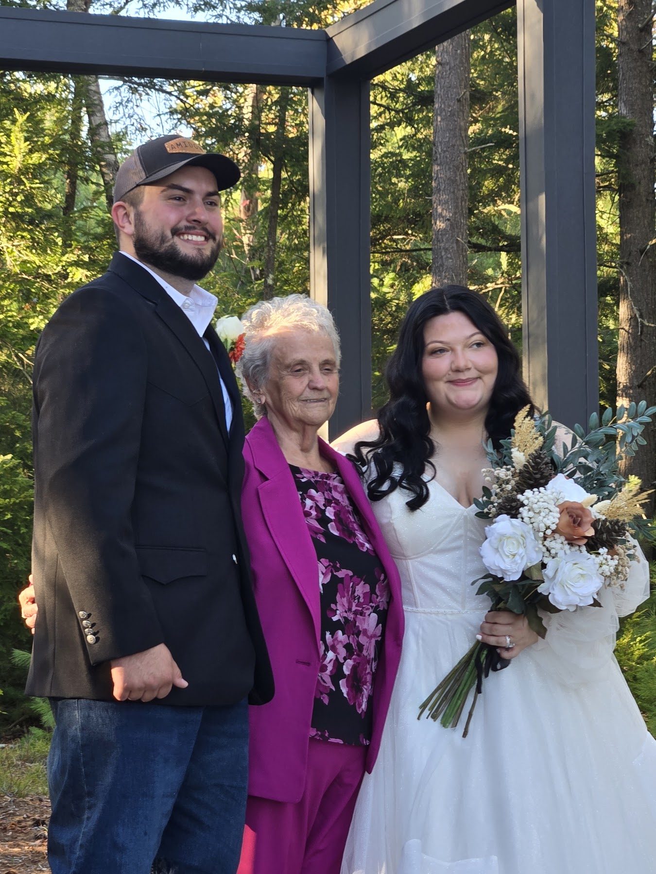 Wedding party gathered outdoors